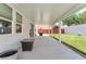 Large covered patio overlooking the green backyard, perfect for entertaining at 4871 La Princesa Ct, North Las Vegas, NV 89031
