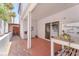 Cozy covered patio area with pavers, sliding door and charming decor elements at 4871 La Princesa Ct, North Las Vegas, NV 89031