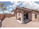Large backyard with covered patio and rock landscaping at 5043 Naff Ridge Dr, Las Vegas, NV 89131