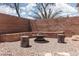 Cozy backyard fire pit area with seating and gravel at 5043 Naff Ridge Dr, Las Vegas, NV 89131