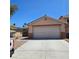 Charming single story home with desert landscaping and a two-car garage at 5043 Naff Ridge Dr, Las Vegas, NV 89131