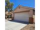 Charming single story home featuring desert landscaping and a two-car garage at 5043 Naff Ridge Dr, Las Vegas, NV 89131