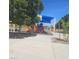 Community playground with slides, climbing structure, and sunshade providing an enjoyable outdoor recreation space at 5043 Naff Ridge Dr, Las Vegas, NV 89131