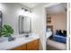 Bathroom vanity with modern fixtures and a bedroom view at 520 Arrowhead Trl # 1322, Henderson, NV 89015