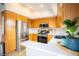 Well-lit kitchen featuring stainless steel appliances, wood cabinets, and a clean white countertop at 520 Arrowhead Trl # 1322, Henderson, NV 89015