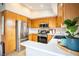 Well-lit kitchen featuring stainless steel appliances, wood cabinets, and a clean white countertop at 520 Arrowhead Trl # 1322, Henderson, NV 89015