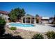 Community pool and spa area with a clubhouse, surrounded by landscaping and sunny skies at 520 Arrowhead Trl # 1322, Henderson, NV 89015