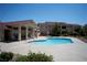 Community pool and spa area with surrounding landscaping and sunny skies at 520 Arrowhead Trl # 1322, Henderson, NV 89015