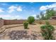 Landscaped backyard features privacy walls and mature trees at 542 Grimsby Ave, Henderson, NV 89014