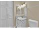 Bathroom featuring a vanity, toilet, and large storage cabinet at 542 Grimsby Ave, Henderson, NV 89014