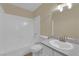 Clean bathroom showcasing white tub, toilet, shower, and updated vanity at 542 Grimsby Ave, Henderson, NV 89014