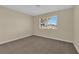 Cozy bedroom with neutral walls, carpet flooring, and natural light at 542 Grimsby Ave, Henderson, NV 89014