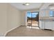 Bright dining area with tile flooring and sliding glass doors to the backyard at 542 Grimsby Ave, Henderson, NV 89014