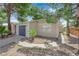 Well-maintained single-story home with desert landscaping, mature trees, and a two-car garage at 542 Grimsby Ave, Henderson, NV 89014