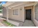 Welcoming front porch featuring a decorative security door, a pergola, and ample shade at 542 Grimsby Ave, Henderson, NV 89014