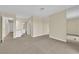 Spacious living room with carpet and multiple access points to other parts of the home at 542 Grimsby Ave, Henderson, NV 89014