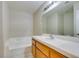 Bathroom features a tub and a white countertop and cabinet at 5424 Comchec Way # 105, Las Vegas, NV 89108