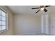 Bedroom with a ceiling fan, new carpet, and lots of natural light at 5424 Comchec Way # 105, Las Vegas, NV 89108