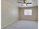 Bedroom has a ceiling fan, new carpet, and bright window with a view at 5424 Comchec Way # 105, Las Vegas, NV 89108