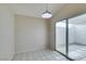 Dining area featuring neutral paint, tile floor and sliding glass doors to the outdoor patio at 5424 Comchec Way # 105, Las Vegas, NV 89108