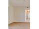Bright hallway with beautiful floors and neutral paint, leading to the kitchen area at 5424 Comchec Way # 105, Las Vegas, NV 89108