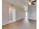 Living room with beautiful floors, neutral paint, a ceiling fan, and vaulted ceilings adds architectural interest at 5424 Comchec Way # 105, Las Vegas, NV 89108