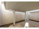 Covered patio area with concrete flooring and textured walls providing a private outdoor space at 5424 Comchec Way # 105, Las Vegas, NV 89108