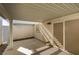 Enclosed patio featuring a sliding glass door, a small window, and concrete flooring at 5424 Comchec Way # 105, Las Vegas, NV 89108