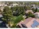 An aerial view of the home showing a spacious backyard with mature trees and neighborhood surroundings at 5528 Morningcross St, Las Vegas, NV 89130
