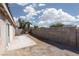 Large, partially landscaped backyard with cinder block perimeter wall at 5528 Morningcross St, Las Vegas, NV 89130