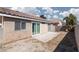 A simple backyard with a small concrete patio offers a blank canvas for outdoor living and entertainment at 5528 Morningcross St, Las Vegas, NV 89130