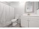 Bathroom with updated vanity, toilet and shower-tub combination at 5528 Morningcross St, Las Vegas, NV 89130