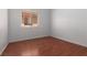 Bedroom featuring wood floors and a window for natural light at 5528 Morningcross St, Las Vegas, NV 89130