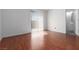 Bedroom features wood floors and a sliding door to outside at 5528 Morningcross St, Las Vegas, NV 89130