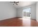 Bedroom features wood floor and sliding door to outside patio at 5528 Morningcross St, Las Vegas, NV 89130