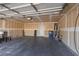 Spacious garage features concrete floors and ample storage space at 5528 Morningcross St, Las Vegas, NV 89130
