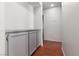 Hallway features wood floors and cabinets for extra storage space at 5528 Morningcross St, Las Vegas, NV 89130