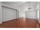 Bright living room features wood-look floors, neutral walls, and a ceiling fan at 5528 Morningcross St, Las Vegas, NV 89130