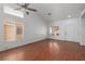 Bright living room features wood-look floors, neutral walls, and lots of natural light from large windows at 5528 Morningcross St, Las Vegas, NV 89130