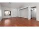 Bright living room features wood-look floors, neutral walls, and lots of natural light from large windows at 5528 Morningcross St, Las Vegas, NV 89130