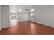 Bright living room features wood-look floors, neutral walls, and a ceiling fan at 5528 Morningcross St, Las Vegas, NV 89130
