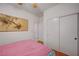 Bedroom featuring natural light from a window, closet and wood flooring at 5548 Spearfish Lake Ct, Las Vegas, NV 89148