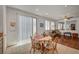 Dining area with sliding door access and hardwood floors at 5548 Spearfish Lake Ct, Las Vegas, NV 89148