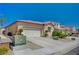 Charming single-story home featuring a terracotta tile roof and a spacious two-car garage at 5548 Spearfish Lake Ct, Las Vegas, NV 89148