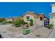 Lovely landscaped front yard with desert landscaping, mature trees, and rock groundcover at 5548 Spearfish Lake Ct, Las Vegas, NV 89148