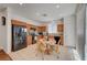 Eat-in kitchen with wood cabinets, tile floors and black appliances at 5548 Spearfish Lake Ct, Las Vegas, NV 89148