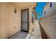 Side entrance with security door on a single-story home at 5548 Spearfish Lake Ct, Las Vegas, NV 89148