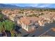 An aerial view showcasing the community's beautiful architecture and landscaping with mountain backdrop at 5855 Valley Dr # 1070, North Las Vegas, NV 89031