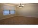 Cozy dining area features tile floors, chandelier lighting, and natural light from a window at 5855 Valley Dr # 1070, North Las Vegas, NV 89031