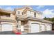 Inviting condo featuring a private garage and a classic tile roof, perfect for comfortable living at 5855 Valley Dr # 1070, North Las Vegas, NV 89031
